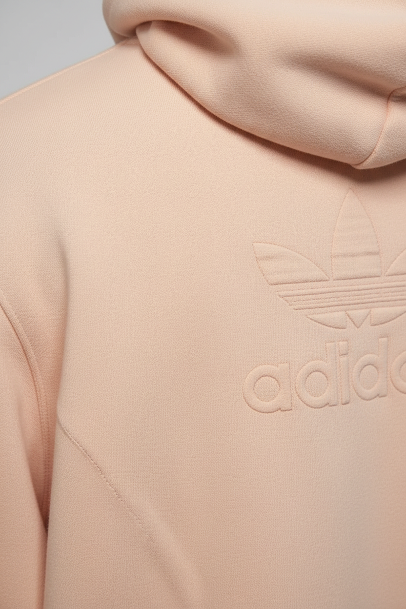 Daily Deals Outlet beige Adidas men's hoodie featuring a subtle embossed Trefoil logo on soft sweat fabric.