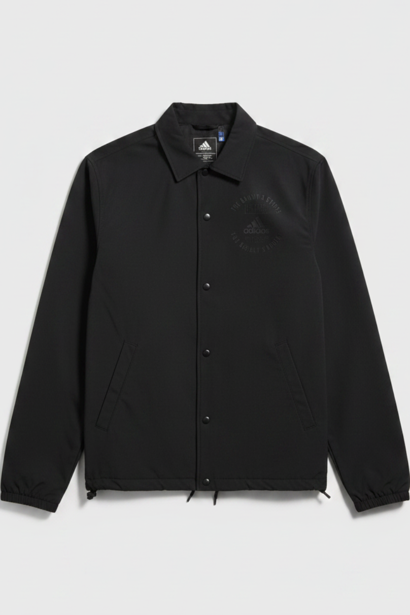 Daily Deals Outlet black Adidas coach jacket made from recycled polyester and elastane with a classic button-up front.