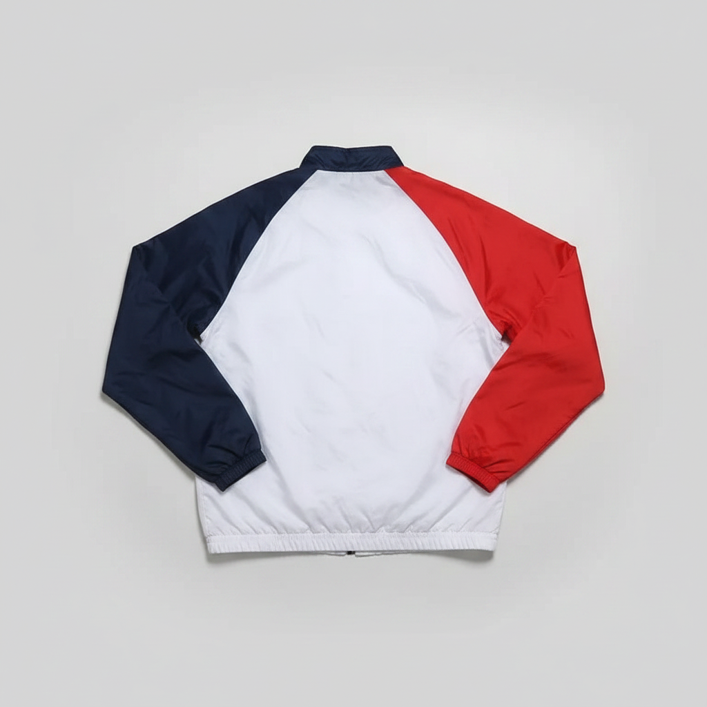 Back view of a Daily Deals Outlet Champion coach jacket in white, blue, and red polyester with ribbed cuffs.