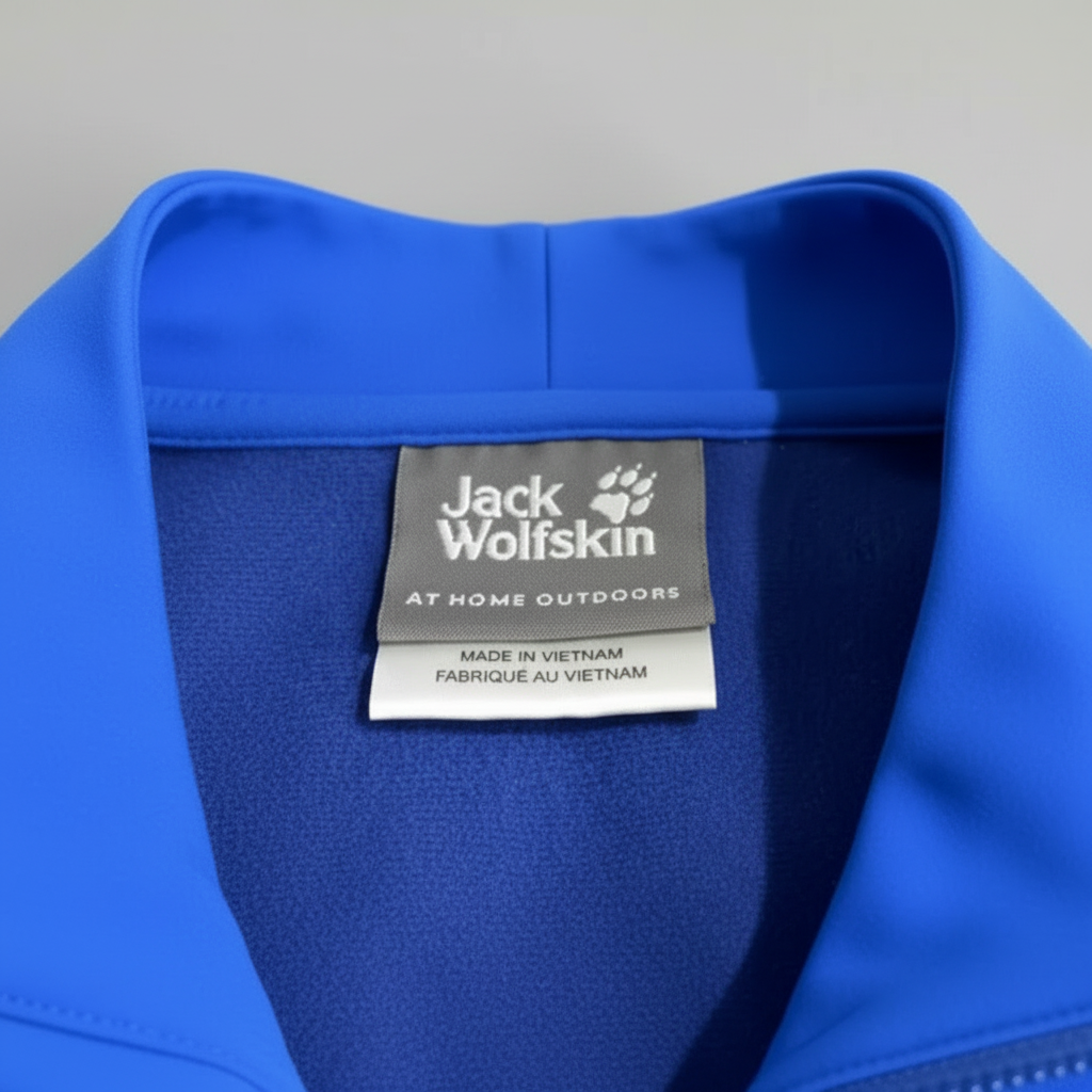 Daily Deals Outlet Jack Wolfskin blue outdoor vest label detail showing brand logo and material texture