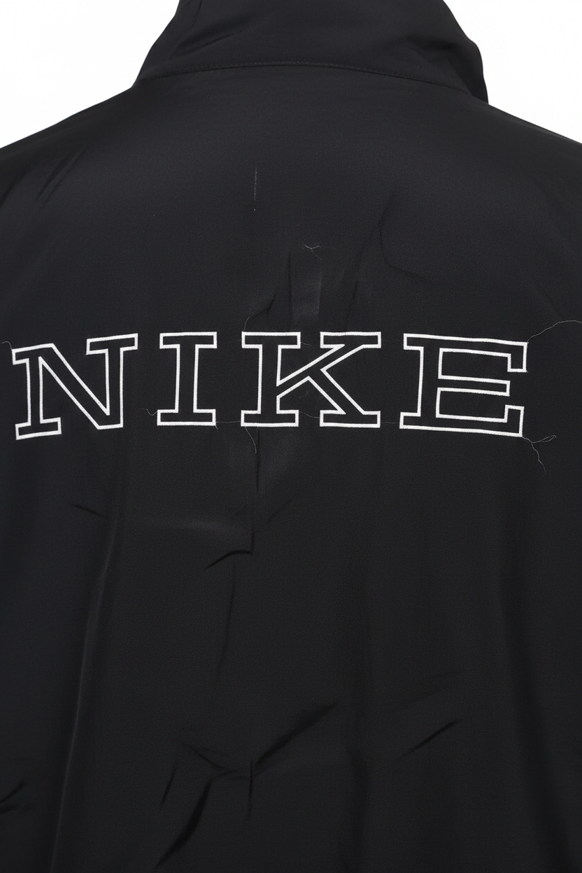 Daily Deals Outlet black Nike jacket featuring a large white outlined logo on the back.