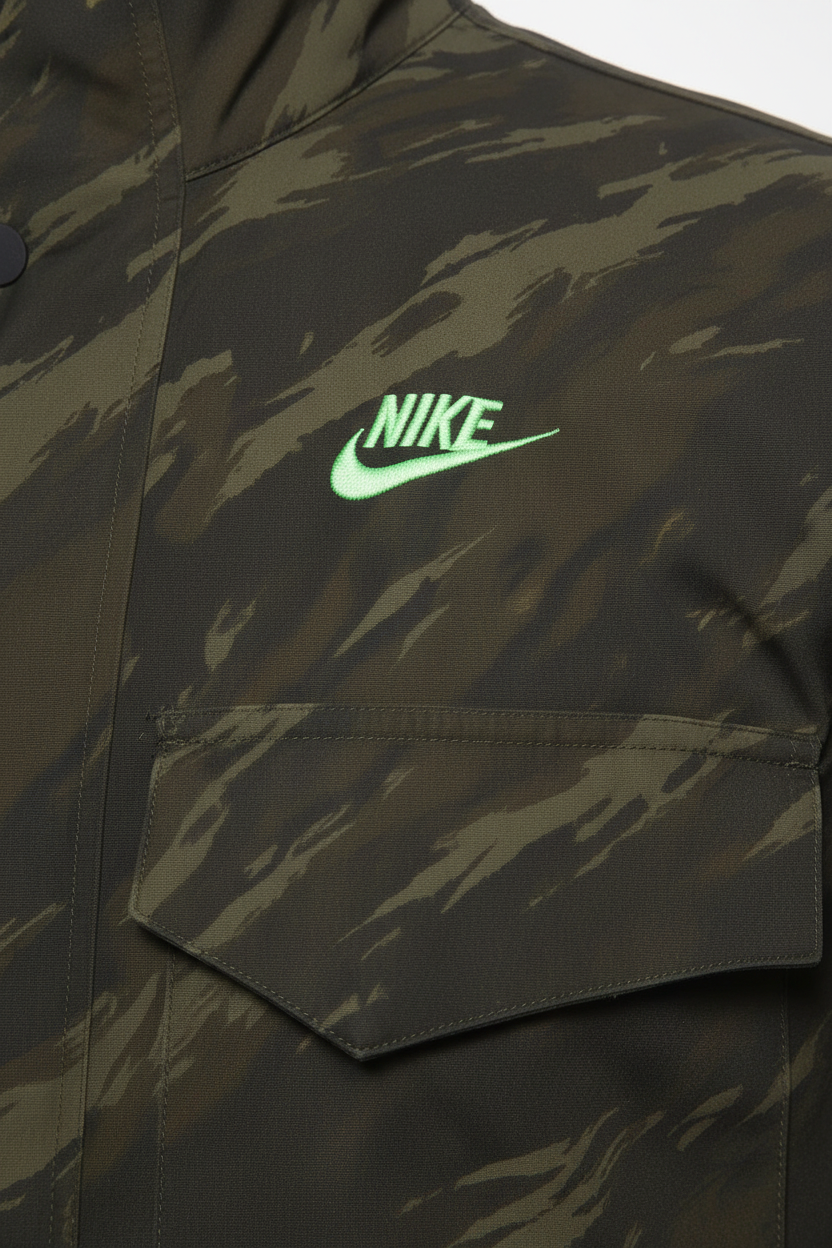 Daily Deals Outlet Nike hunting jacket in green and grey camouflage pattern with embroidered logo detail.